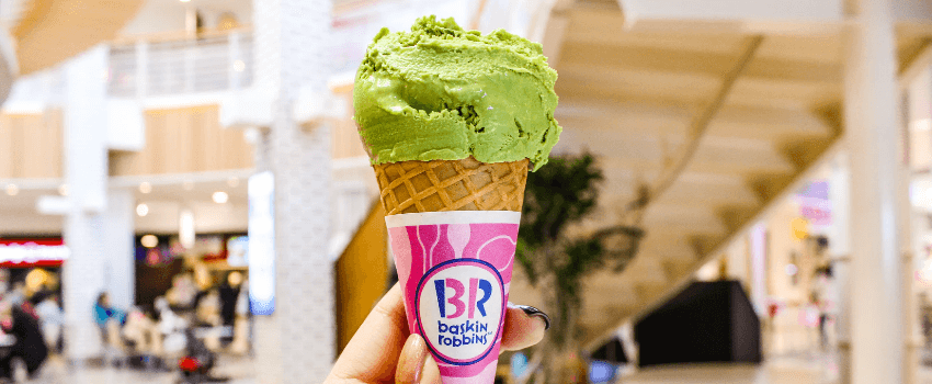 holding a baskin robbins ice cream cone